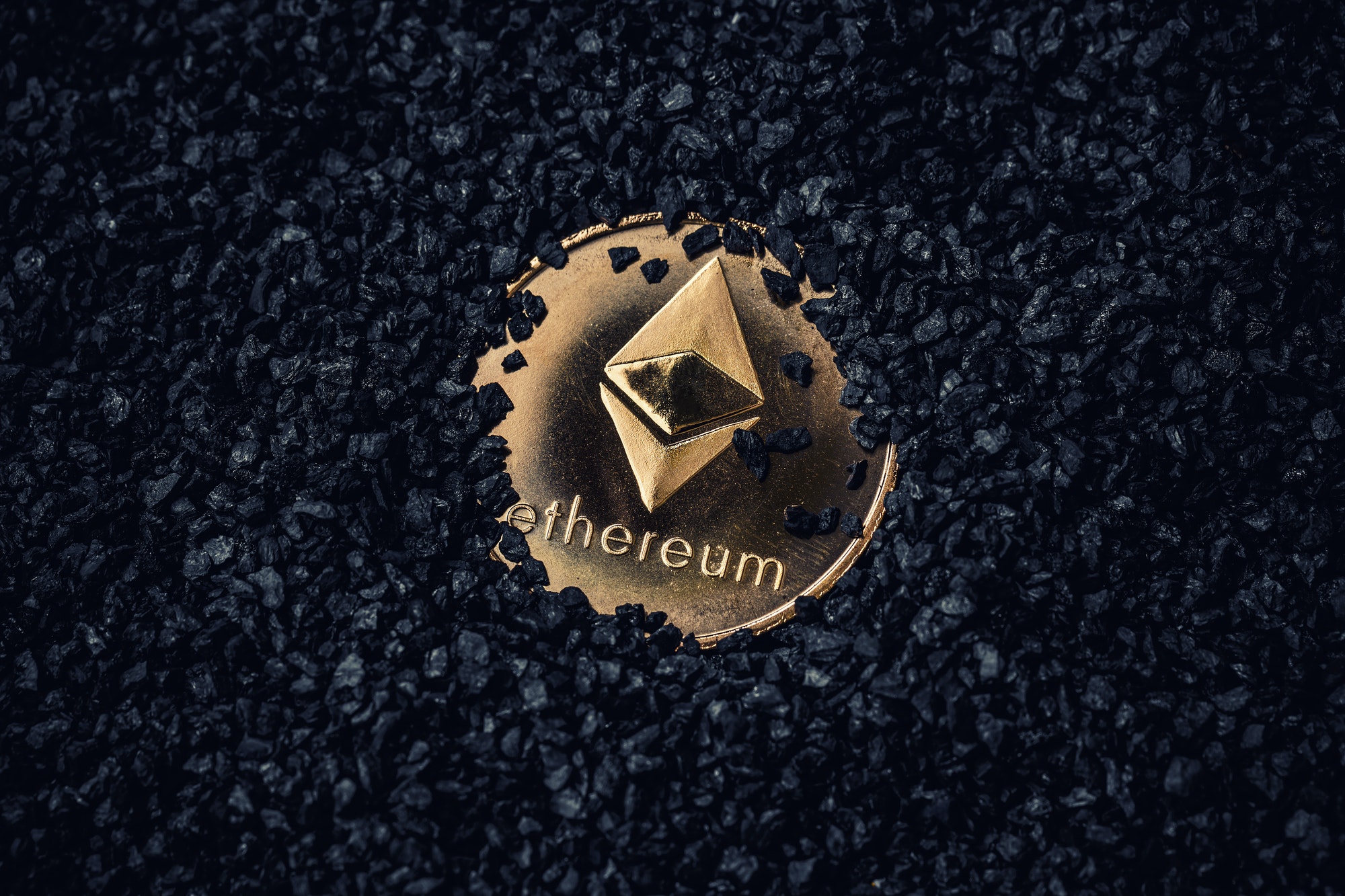 Gold coin with cryptocurrency logo